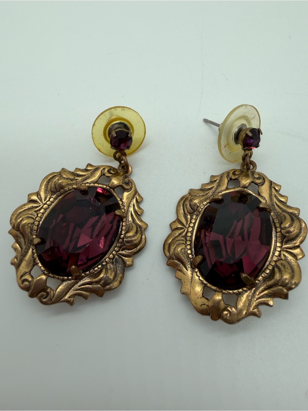 Vintage brass tone purple glass rhinestone dangle earrings